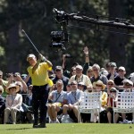 Jack Nicklaus tees off at the first hole during the Par 3 competition before the Masters golf tournament Wednesday, April 6, 2011, in Augusta, Ga. A camera, affectionately known as WALL-E with its two lenses reminiscent of the eyes on the animated movie robot, shoots sports in 3-D over the first tee box. (AP Photo/Chris O'Meara)

