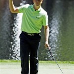 Luke Donald of England holds up his ball after putting on the ninth hole during the Par 3 competition before the Masters golf tournament Wednesday, April 6, 2011, in Augusta, Ga. (AP Photo/Matt Slocum)