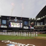 Fireworks explode in centerfield as the Arizona Diamondbacks line up to be announced to the crowd prior to facing the Cincinnati Reds in their home-opening baseball game Friday, April 8, 2011, in Phoenix. (AP Photo/Paul Connors)