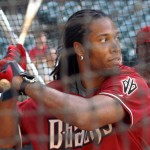 Cardinals WR Larry Fitzgerald takes some cuts during batting practice at Chase Field Tuesday, April 12, 2011. (Adam Green/Arizonasports.com)
