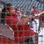 Cardinals WR Larry Fitzgerald takes some cuts during batting practice at Chase Field Tuesday while D-backs hitting coach Don Baylor watches April 12, 2011. (Adam Green/Arizonasports.com)
