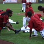 Cardinals WR Larry Fitzgerald stretches with the Diamondbacks before batting practice at Chase Field Tuesday, April 12, 2011. (Adam Green/Arizonasports.com)