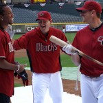 Cardinals WR Larry Fitzgerald shares a laugh with D-backs pitcher Joe Saunders during batting practice at Chase Field Tuesday, April 12, 2011. (Adam Green/Arizonasports.com)