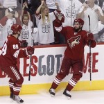 Phoenix Coyotes' David Schlemko, right, celebrates his goal against the Detroit Red Wings with teammate Mikkel Boedker (89), of Denmark, during the second period in Game 3 of a first-round series NHL Stanley Cup playoffs hockey game Monday, April 18, 2011, in Glendale, Ariz. (AP Photo/Ross D. Franklin)