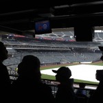 Fans wait during a rain delay for the baseball game between the Arizona Diamondbacks and the New York Mets Saturday, April 23, 2011, at CitiField in New York. (AP Photo/Frank Franklin II)