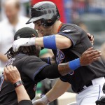 New York Mets' David Wright, right, gets hugged by teammate Jose Reyes at the dugout after Wright hit his second home run of the baseball game against the Arizona Diamondbacks, in the fourth inning in New York, Sunday, April 24, 2011. The Mets won 8-4. (AP Photo/Paul J. Bereswill)
