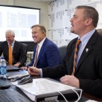 Denver Broncos head coach John Fox, left, John Elway, center, executive vice president of football operations, and general manager Brian Xanders sit in the team's "war room" just as Thursday night's NFL football draft got underway at the Broncos' Dove Valley facility in Englewood, Colo., April 28, 2011. The Broncos selected Texas A&M linebacker Von Miller as their first-round pick, the second overall pick in the year's draft. (AP Photo/Eric Bakke, Pool)