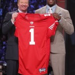 Missouri defensive end Aldon Smith, right, holds up a jersey with NFL commissioner Roger Goodell after he was selected as the seventh overall pick by the San Francisco 49ers in the first round of the NFL football draft at Radio City Music Hall Thursday, April 28, 2011, in New York. (AP Photo/Jason DeCrow)