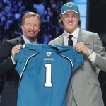 Missouri quarterback Blaine Gabbert poses for photographs with NFL commissioner Roger Goodell after he was selected as the 10th overall pick by the Jacksonville Jaguars in the first round of the NFL football draft at Radio City Music Hall on Thursday, April 28, 2011, in New York. (AP Photo/Jason DeCrow)