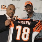 Cincinnati Bengals head coach Marvin Lewis, left, poses with the team's first round draft pick A.J. Green during an NFL football news conference, Friday, April 29, 2011 in Cincinnati. Green, a wide receiver from Georgia, will wear number 18 for the Bengals. (AP Photo/Al Behrman)