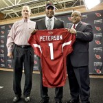 Arizona Cardinals' first-round draft pick Patrick Peterson, center, displays a jersey with head coach Ken Whisenhunt, left, and general manager Rod Graves, Friday, April 29, 2011, at the Cardinals' practice facility in Tempe, Ariz. Peterson, a cornerback from LSU, was the fifth pick overall in the NFL draft. (AP Photo/Matt York)
