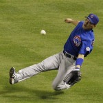 Chicago Cubs' Kosuke Fukudome makes a diving catch on a line drive by Arizona Diamondbacks' Stephen Drew in the eighth inning during an MLB baseball game Friday, April 29, 2011, in Phoenix. (AP Photo/Ross D. Franklin)
