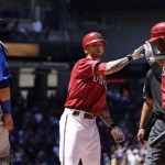 Arizona Diamondbacks' Ryan Roberts, middle, celebrates his home run with teammate Juan Miranda as Chicago Cubs' Geovany Soto (18) looks on during the second inning of a baseball game Sunday, May 1, 2011, in Phoenix. (AP Photo/Ross D. Franklin)