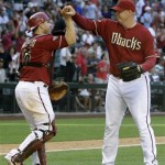 Arizona Diamondbacks' J.J. Putz, right, celebrates a game-ending double play against the Chicago Cubs with teammate Miguel Montero in a baseball game Sunday, May 1, 2011, in Phoenix. The Diamondbacks defeated the Cubs 4-3. (AP Photo/Ross D. Franklin)
