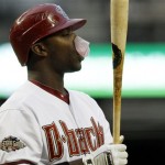 Arizona Diamondbacks' Justin Upton gets a popped bubble of gum stuck on his face as he bats against the Colorado Rockies during the first inning of an MLB baseball game, Thursday, May 5, 2011, in Phoenix. (AP Photo/Ross D. Franklin)