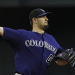 Colorado Rockies' Jason Hammel throws to first base on a pickoff attempt during the first inning of an MLB baseball game against the Arizona Diamondbacks, Thursday, May 5, 2011, in Phoenix. (AP Photo/Ross D. Franklin)