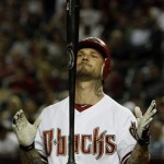 Arizona Diamondbacks' Ryan Roberts tosses his bat in the air after striking out against the Colorado Rockies during the seventh inning of an MLB baseball game Thursday, May 5, 2011, in Phoenix. (AP Photo/Ross D. Franklin)