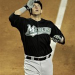 Florida Marlins' Logan Morrison salute as he crosses home plate after hitting a solo home run during the fifth inning of a baseball game against the Arizona Diamondbacks' Tuesday, May 31, 2011, in Phoenix. (AP Photo/Matt York)