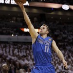 Dallas Mavericks' Jose Juan Barea (11) goes for a basket against the Miami Heat during the first half of Game 1 of the NBA Finals basketball game Tuesday, May 31, 2011, in Miami. (AP Photo/David J. Phillip)