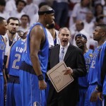 Dallas Mavericks head coach Rick Carlisle, lower center, talks to the team during the first half of Game 1 of the NBA Finals basketball game against the Miami Heat, Tuesday, May 31, 2011, in Miami. (AP Photo/Lynne Sladky)