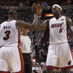 Miami Heat's Dwyane Wade (3) is congratulated by Lebron James (6) after Wade was fouled during the first half of Game 1 of the NBA Finals basketball game against the Dallas Mavericks, Tuesday, May 31, 2011, in Miami. (AP Photo/Lynne Sladky)