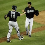 Florida Marlins pitcher Leo Nunez, right, celebrates with catcher John Buck after the final out of a baseball game against the Arizona Diamondbacks' Tuesday, May 31, 2011, in Phoenix. The Marlins won 5-2. (AP Photo/Matt York)