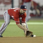 Washington Nationals' Danny Espinosa fields a ground ball for an out by Arizona Diamondbacks' Gerardo Parra in the second inning of an MLB baseball game on Saturday, June 4, 2011, in Phoenix. (AP Photo/Paul Connors)