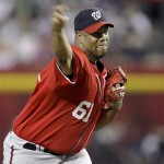 Washington Nationals' Livan Hernandez delivers a pitch against the Arizona Diamondbacks in the first inning of an MLB baseball game on Saturday, June 4, 2011, in Phoenix. (AP Photo/Paul Connors)
