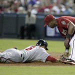 Washington Nationals' Ian Desmond, left, is tagged out by Arizona Diamondbacks' first baseman Juan Miranda, right, while diving back to the base in the second inning of an MLB baseball game on Sunday, June 5, 2011, in Phoenix. (AP Photo/Paul Connors)