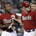 Arizona Diamondbacks' Justin Upton, left, is restrained by teammate Matt Williams after being hit with a pitch in the sixth inning against the Washington Nationals during their MLB baseball game on Sunday, June 5, 2011, in Phoenix. Nationals pitcher Jason Marquis was ejected by home plate umpire Rob Drake for hitting Upton with the pitch. (AP Photo/Arizona Republic, David Kadlubowski)