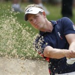 Luke Donald, of England, watches his bunker shot to the 17th green during the first round of the U.S. Open Championship golf tournament in Bethesda, Md., Thursday, June 16, 2011. (AP Photo/Eric Gay)