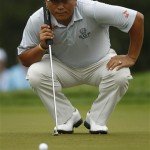 K. J. Choi, of South Korea, lines up his putt on the first green during the first round of the U.S. Open Championship golf tournament in Bethesda, Md., Thursday, June 16, 2011. (AP Photo/Evan Vucci)