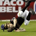 Actor Chord Overstreet robs former Oakland Athletic Rickey Henderson of a hit during the All Star Celebrity Softball game Sunday, July 10, 2011, in Phoenix. (AP Photo/Ross D. Franklin)