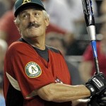 Baseball Hall of Famer Rollie Fingers hits during the All Star Celebrity Softball game Sunday, July 10, 2011, in Phoenix. (AP Photo/Ross D. Franklin)