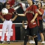 U.S. National Team Soccer player Carlos Bocanegra prepares to kick a soccer ball during the All Star Celebrity Softball game Sunday, July 10, 2011, in Phoenix. (AP Photo/Ross D. Franklin)