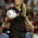 Former U.S. Olympic softball pitcher Jennie Finch prepares to pitch a soccer ball to Carlos Bocanegra during the All Star Celebrity Softball game Sunday, July 10, 2011, in Phoenix. (AP Photo/Ross D. Franklin)