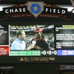 Cardinals WR Larry Fitzgerald being interviewed by MLB's Chris Rose at the All Star Celebrity Softball Game at Chase Field. (Tyler Bassett/ArizonaSports.com)