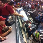 The photo of the evening. This fan -- who already had three balls -- went to reach for another HR ball when he fell over the railing. He was pulled back to safety and later told me "no tragedy tonight" and that he was holding onto the bar the entire time. ... If you say so. (Tyler Bassett)