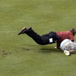 There were 95 home runs hit on the evening but the best hit of all may have come by the security guard who left his feet to take down the fan who decided it would be a good idea to run around right field. (Associated Press)