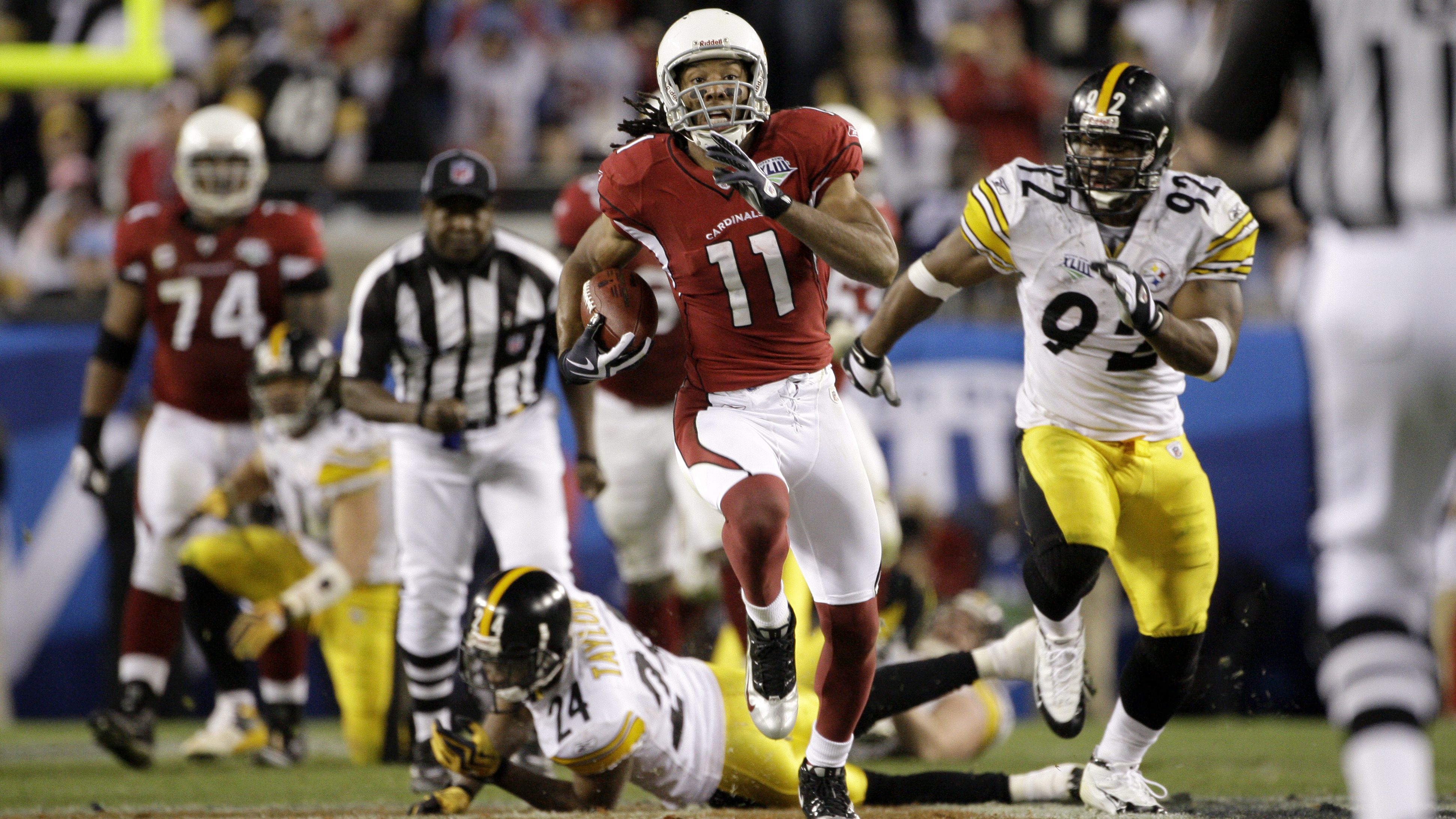 Arizona Cardinals wide receiver Larry Fitzgerald (11) breaks away from Pittsburgh Steelers cornerba...