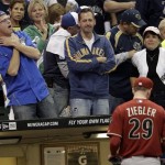 Fans react as Arizona Diamondbacks relief pitcher Brad Ziegler (29) leaves the game during the sixth inning of Game 2 of baseball's National League division series against the Milwaukee Brewers Sunday, Oct. 2, 2011, in Milwaukee. (AP Photo/David J. Phillip)
