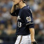 Milwaukee Brewers starting pitcher Zack Greinke reacts after giving up a two-run home run to Arizona Diamondbacks' Justin Upton during the fifth inning of Game 2 of baseball's National League division series Sunday, Oct. 2, 2011, in Milwaukee. (AP Photo/Jeffrey Phelps)
