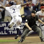 Milwaukee Brewers' Nyjer Morgan (2) reacts after scoring during the fourth inning of Game 5 of baseball's National League division series against the Arizona Diamondbacks Friday, Oct. 7, 2011, in Milwaukee. (AP Photo/David J. Phillip)