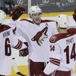 Phoenix Coyotes defenseman Keith Yandle (3), celebrates with David Schlemko (6) and Taylor Pyatt (14) after the Coyotes beat the Nashville Predators in an NHL hockey game on Tuesday, Dec. 6, 2011, in Nashville, Tenn. Yandle scored the game-winning goal as the Coyotes won 3-2. (AP Photo/Mark Humphrey)
