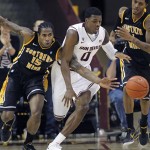 Arizona State's Carrick Felix and Southern Miss's Torye Pelham battle for a loose ball during the first half of their NCAA basketball game Monday, Dec. 19, 2011 in Tempe. (AP Photo/Arizona Republic, David Kadlubowski)