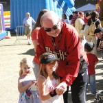 Diamondbacks owner Ken Kendrick poses with some young fans at the 
2012 Subway FanFest. (Photo by Vince Marotta/Arizona Sports)