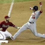 St. Louis Cardinals' Kyle Lohse, right, 
stretches out to reach third base before 
Arizona Diamondbacks third baseman Ryan 
Roberts, left, can apply the tag in the fifth 
inning of a baseball game on Wednesday, May 9, 
2012, in Phoenix. (AP Photo/Paul Connors)