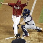 Arizona Diamondbacks' Lyle Overbay, top left, 
is tagged out by St. Louis Cardinals catcher 
Tony Cruz, top right, as umpire Laz Diaz, 
bottom, looks on in the fourth inning of a 
baseball game on Wednesday, May 9, 2012, in 
Phoenix. (AP Photo/Paul Connors)