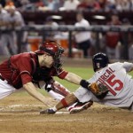 St. Louis Cardinals' Rafael Furcal, right, is 
tagged out by Arizona Diamondbacks catcher 
Miguel Montero, left, while sliding with his 
hand outstretched to touch home plate in the 
third inning of a baseball game on Wednesday, 
May 9, 2012, in Phoenix.(AP Photo/Paul Connors)
