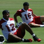 Cardinals receivers Andre Roberts and Michael 
Floyd stretch prior to Day 2 of Cardinals OTAs. 
(Adam Green/Arizona Sports)